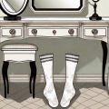 A pair of garter belts and stockings neatly laid out on a vintage dressing table with a mirror in the background