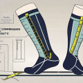 A pair of compression stockings with a measuring tape wrapped around it